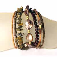 BRACCIALI RIGIDINI CON PERLE IN CERAMICA